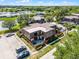 Aerial view showcases condominiums featuring mature trees and dedicated parking spaces at 917 Royal Oak Blvd, Leesburg, FL 34748