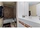Bathroom with shower and tub combo and updated vanity area at 917 Royal Oak Blvd, Leesburg, FL 34748