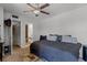 Bedroom with ceiling fan and access to an ensuite bathroom at 917 Royal Oak Blvd, Leesburg, FL 34748