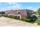 Exterior of the property featuring balconies and well maintained landscaping at 917 Royal Oak Blvd, Leesburg, FL 34748