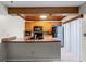 Kitchen featuring wood cabinets, modern appliances, and eat-in counter at 917 Royal Oak Blvd, Leesburg, FL 34748