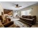 Living room showcasing stairs to the second level and front entryway at 917 Royal Oak Blvd, Leesburg, FL 34748