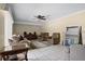Living room with tile flooring, ceiling fan, comfortable seating, and natural light at 917 Royal Oak Blvd, Leesburg, FL 34748