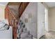 Carpeted staircase with decorative tiled wall and wood railing at 917 Royal Oak Blvd, Leesburg, FL 34748