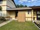 Townhouse features a fenced front yard, a fresh exterior paint job, and well-maintained landscaping at 963 Stucki Ter, Winter Garden, FL 34787