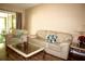 Inviting living room featuring comfortable seating and access to the screened patio at 963 Stucki Ter, Winter Garden, FL 34787