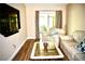 Comfortable living room with sliding glass doors and stylish furnishings at 963 Stucki Ter, Winter Garden, FL 34787