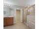 Bathroom with walk-in shower, garden tub, double sinks and closet at 10097 Lake District Ln, Orlando, FL 32832