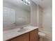 Bathroom featuring vanity, sink, and tiled shower/tub combo at 10097 Lake District Ln, Orlando, FL 32832