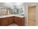Bathroom features double sinks, soaking tub, walk-in shower, and closet at 10097 Lake District Ln, Orlando, FL 32832