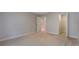 Neutral bedroom with closet and entry to hallway at 10097 Lake District Ln, Orlando, FL 32832