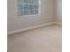 Cozy bedroom featuring large window and carpet floors at 10097 Lake District Ln, Orlando, FL 32832