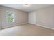 Bright bedroom with carpet, closet and large window providing natural light at 10097 Lake District Ln, Orlando, FL 32832