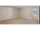 Bright bedroom features neutral carpet and double door closet at 10097 Lake District Ln, Orlando, FL 32832