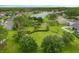 Overhead view of a lush community park surrounded by beautiful homes and a tranquil lake at 10097 Lake District Ln, Orlando, FL 32832