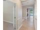 Bright hallway with tile flooring leading to rooms with lake view at 10097 Lake District Ln, Orlando, FL 32832