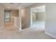 Upstairs hallway with carpeted floors leads to spacious main bedroom at 10097 Lake District Ln, Orlando, FL 32832