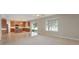 Open-concept kitchen, connecting to a Gathering room, featuring a center island with bar seating at 10097 Lake District Ln, Orlando, FL 32832