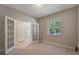 Comfortable office space featuring a large window, double doors and neutral colors at 10097 Lake District Ln, Orlando, FL 32832