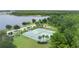 Overhead view of tennis courts and playground with a scenic lake in the background at 10097 Lake District Ln, Orlando, FL 32832