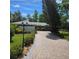 Charming single-story home with a beautiful brick driveway and mature landscaping at 1010 Bolton Rd, New Smyrna Beach, FL 32168