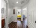 Upstairs hallway with hardwood floors and access to bedrooms and a bathroom at 10255 Hartford Maroon Rd, Orlando, FL 32827