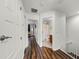 Bright upstairs hallway with hardwood floors leading to various rooms at 10255 Hartford Maroon Rd, Orlando, FL 32827