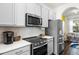 Bright kitchen featuring stainless steel appliances, white countertops, and gray cabinetry at 10255 Hartford Maroon Rd, Orlando, FL 32827