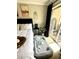 Comfortable bedroom featuring a pet bed, black accent table, and sliding door to a private balcony at 109 Oyster Bay Cir # 120, Altamonte Springs, FL 32701
