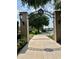 Picturesque entryway leading to a park with a lake view, framed by an ornate archway at 109 Oyster Bay Cir # 120, Altamonte Springs, FL 32701