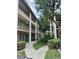 Condominium building exterior with landscaping and balconies, featuring multiple units and a walkway at 109 Oyster Bay Cir # 120, Altamonte Springs, FL 32701