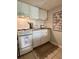 Efficient kitchen with white cabinets, appliances, and stylish fixtures, ready for cooking and entertaining at 109 Oyster Bay Cir # 120, Altamonte Springs, FL 32701