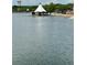 Scenic lake view featuring a charming gazebo on the water and the Altamonte Springs water tower in the background at 109 Oyster Bay Cir # 120, Altamonte Springs, FL 32701