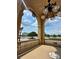 Beautiful patio view with elegant chandelier, overlooking serene water and lush landscaping at 109 Oyster Bay Cir # 120, Altamonte Springs, FL 32701