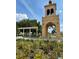 Charming outdoor pavilion with a clock tower, nestled amidst lush greenery and manicured landscaping at 109 Oyster Bay Cir # 120, Altamonte Springs, FL 32701