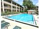 Large community pool provides a refreshing escape, complete with lounge chairs and a well-maintained surrounding area at 109 Oyster Bay Cir # 120, Altamonte Springs, FL 32701