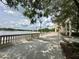 Scenic walkway with decorative lampposts and views of the lake, trees, and architecture at 109 Oyster Bay Cir # 120, Altamonte Springs, FL 32701