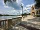 Beautiful waterfront promenade with decorative railings offers stunning views of the water and distant buildings at 109 Oyster Bay Cir # 120, Altamonte Springs, FL 32701