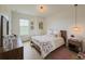 Bedroom features natural light from the window, modern light fixtures and wood-look flooring at 11091 Bagley Aly, Windermere, FL 34786