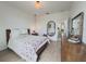 Bedroom with wooden dresser, wood-look floors, and modern decor at 11091 Bagley Aly, Windermere, FL 34786