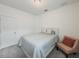 Cozy bedroom featuring neutral tones, a comfortable bed, and an accent chair at 11091 Bagley Aly, Windermere, FL 34786