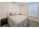 Comfortable bedroom with neutral decor, including a plush bed and gray carpeting at 11091 Bagley Aly, Windermere, FL 34786