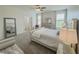Bright bedroom with a neutral color palette, plush carpet, and ample natural light from large windows at 11091 Bagley Aly, Windermere, FL 34786