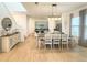 Open-concept dining area showcases elegant decor, stylish lighting, and views into the modern kitchen at 11091 Bagley Aly, Windermere, FL 34786