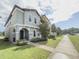 Beautiful two-story home showcases a well-maintained lawn and appealing architectural details under a partly cloudy sky at 11091 Bagley Aly, Windermere, FL 34786