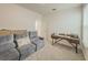 Spacious flex room with gray sofa, desk, and natural light ideal for living or office at 11091 Bagley Aly, Windermere, FL 34786
