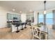 Modern kitchen features a large island with bar seating, updated stainless appliances, and a sunlit dining area at 11091 Bagley Aly, Windermere, FL 34786