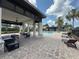 Elegant poolside lounge area with comfortable seating and shaded retreat at 11091 Bagley Aly, Windermere, FL 34786