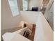 Bright and airy staircase with white walls and hardwood floors, leading to the upper level at 11091 Bagley Aly, Windermere, FL 34786