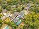 The aerial view showcases the beautiful home and the pool, garage, and outdoor living spaces in the backyard at 1127 W Harvard St, Orlando, FL 32804
